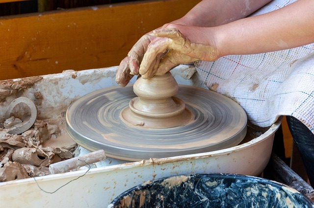 artisan hands crafting handmade designer jewelry in workshop