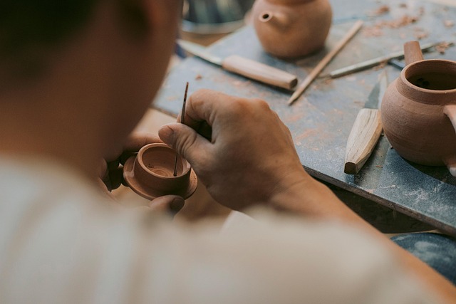 artisan hands crafting handmade jewelry in premium workshop